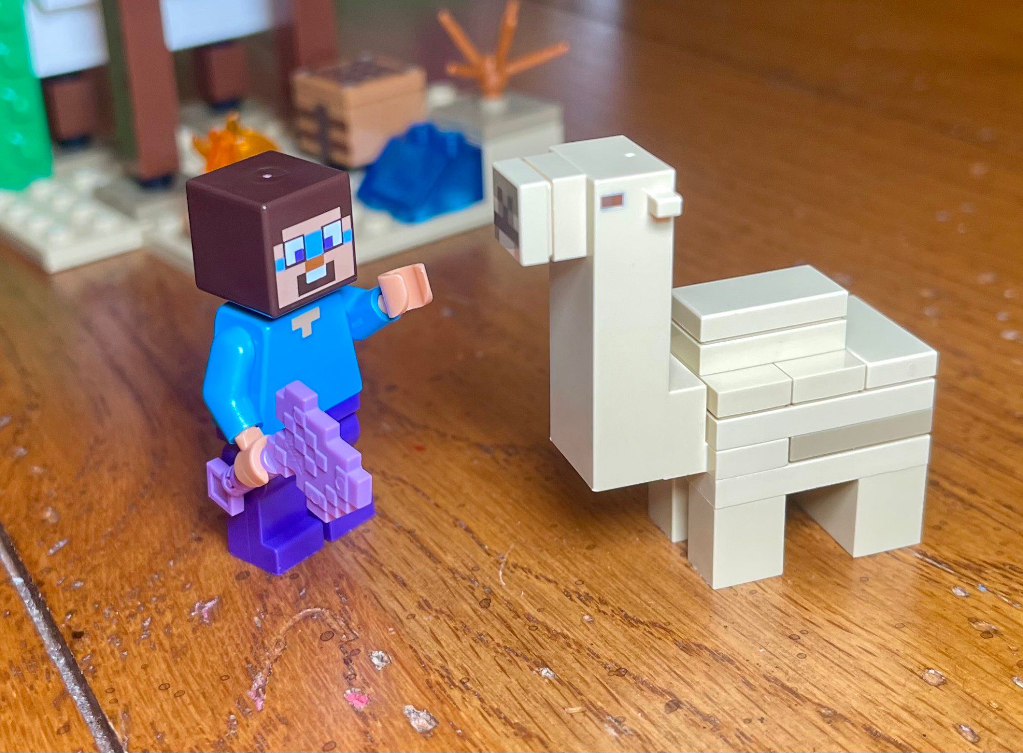 LEGO 21251 Steve minifig holding diamond pickaxe next to baby camel