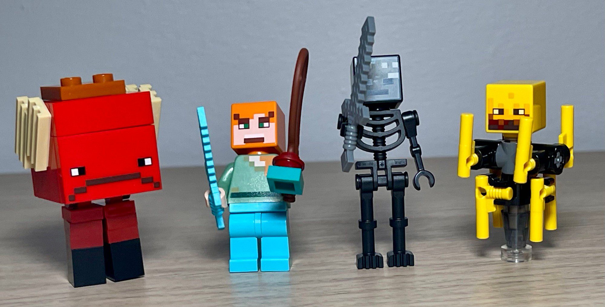 LEGO 21266 Nether Lava Battle four characters lineup: Strider, Alex, Wither Skeleton, Blaze