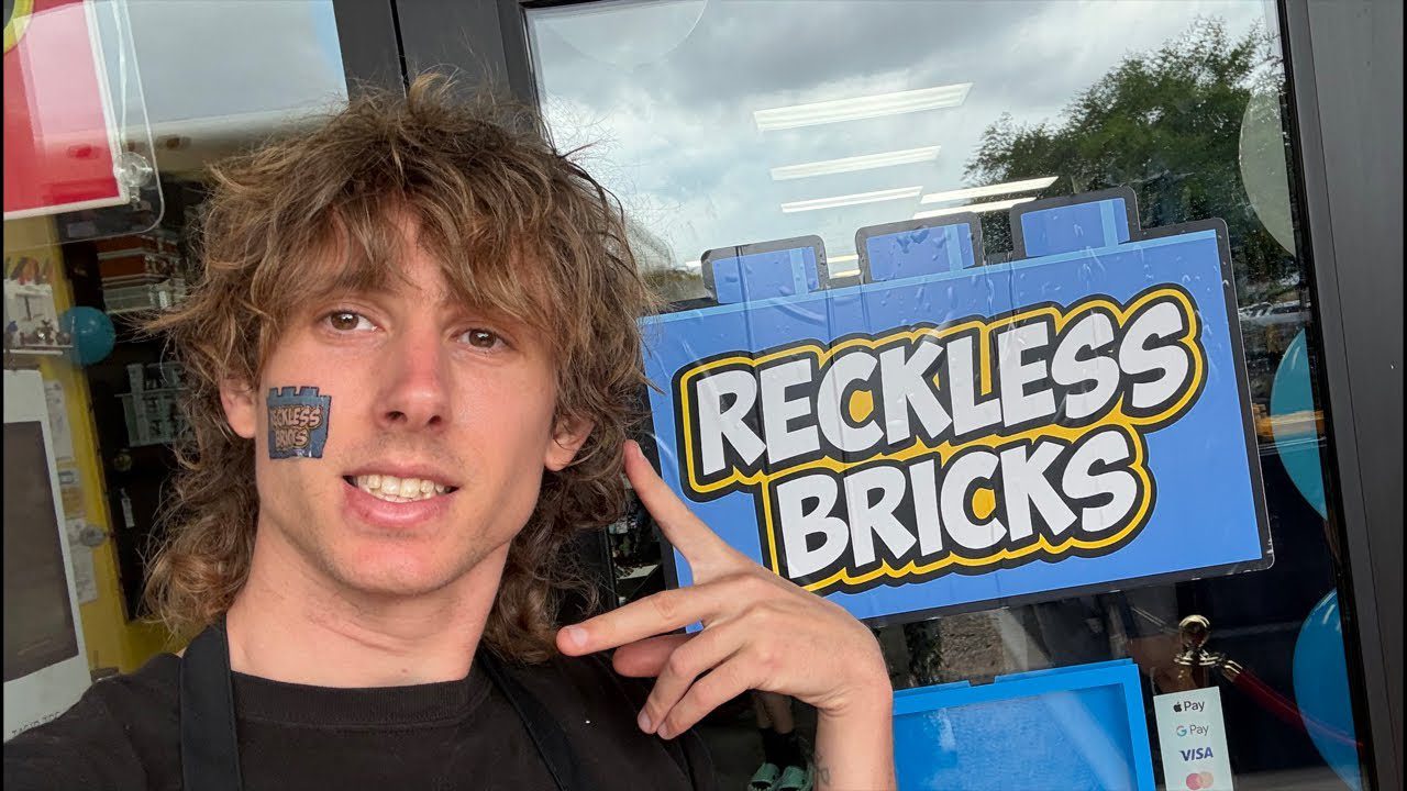 Ben Schneider, known online as Reckless Ben, standing in front of the new Reckless Bricks store sign in Tucson